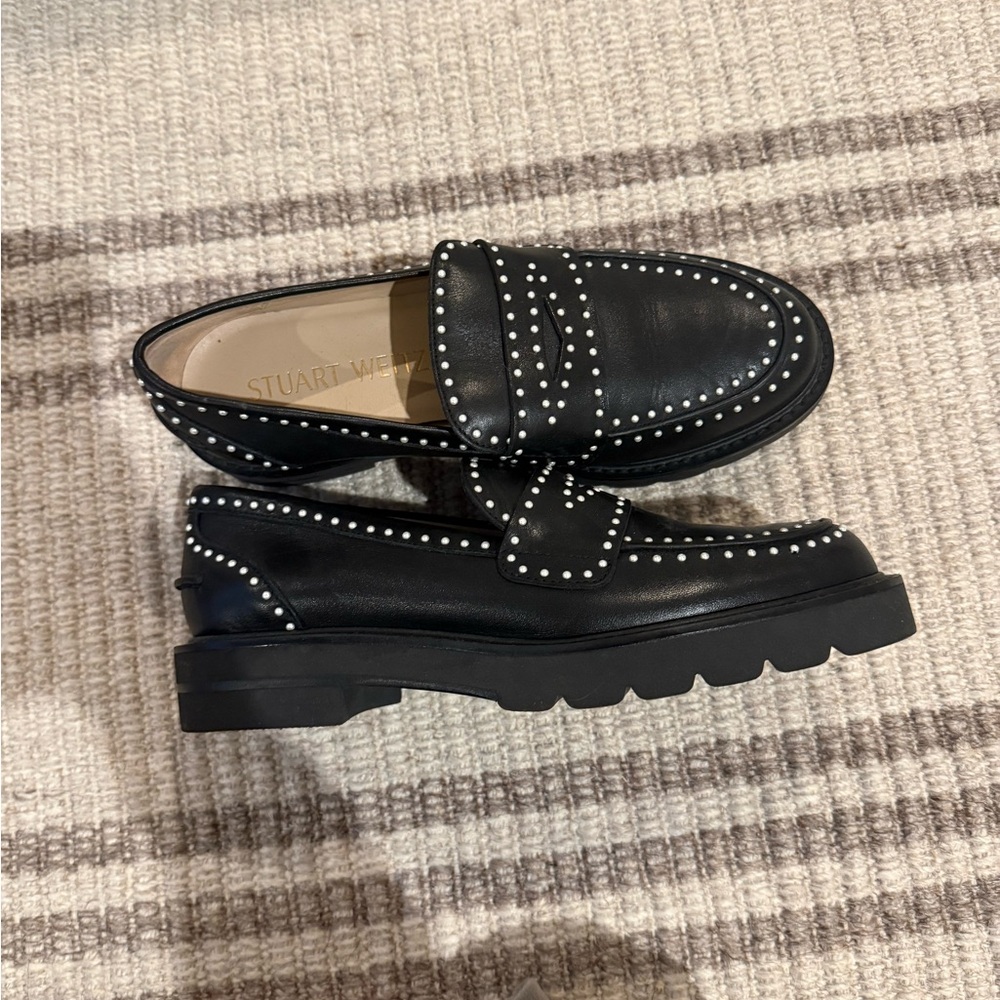 Stuart Weitzman Black Sole with Gold Accents